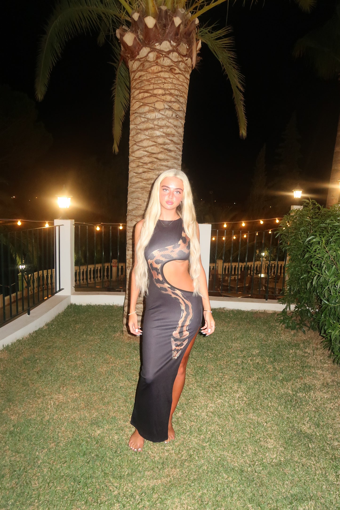 Black cut out snake dress
