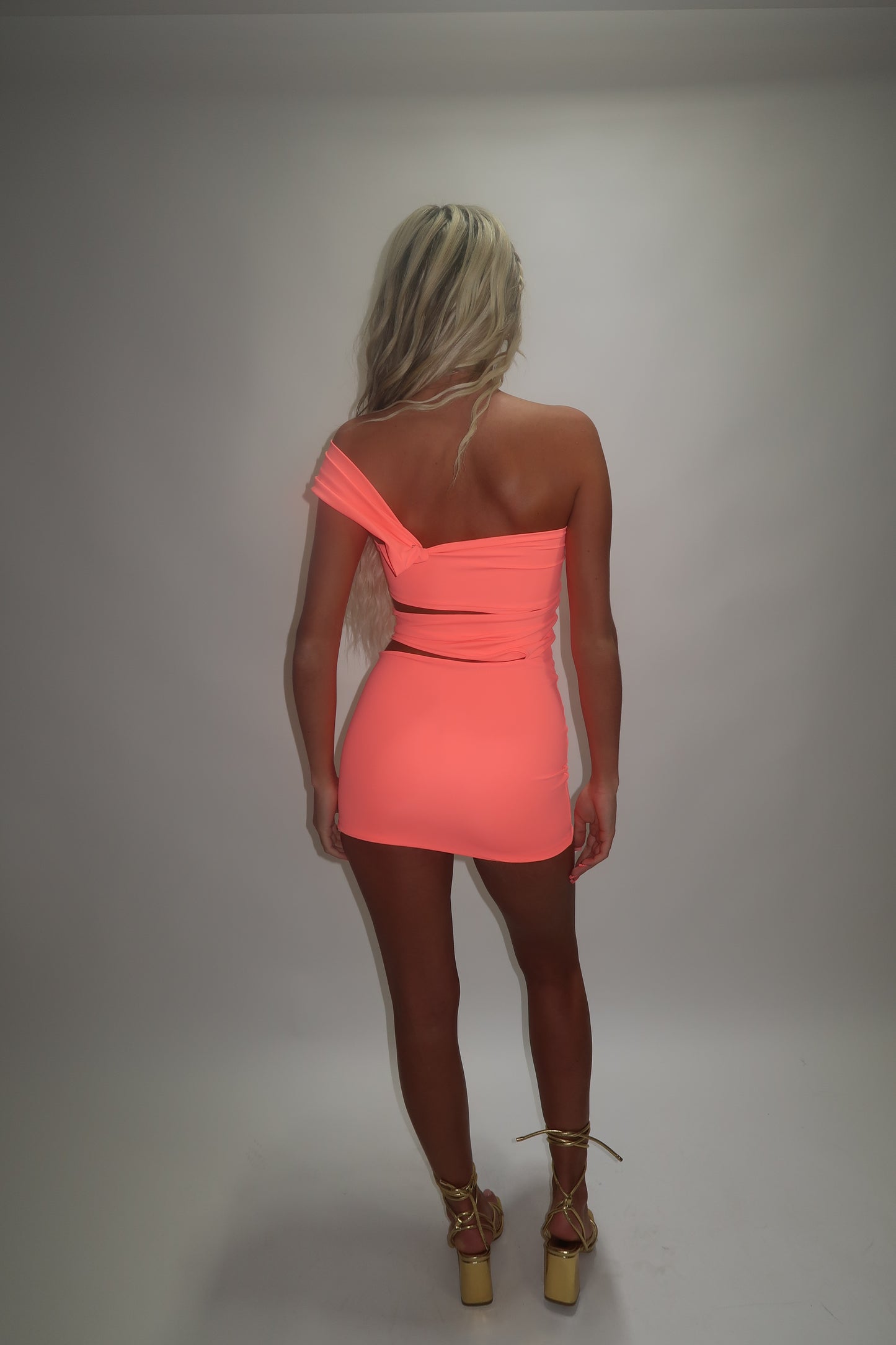 LIMITED EDITION HAND MADE AND DESIGNED IN HOUSE: ‘Aries’ coral cut out dress