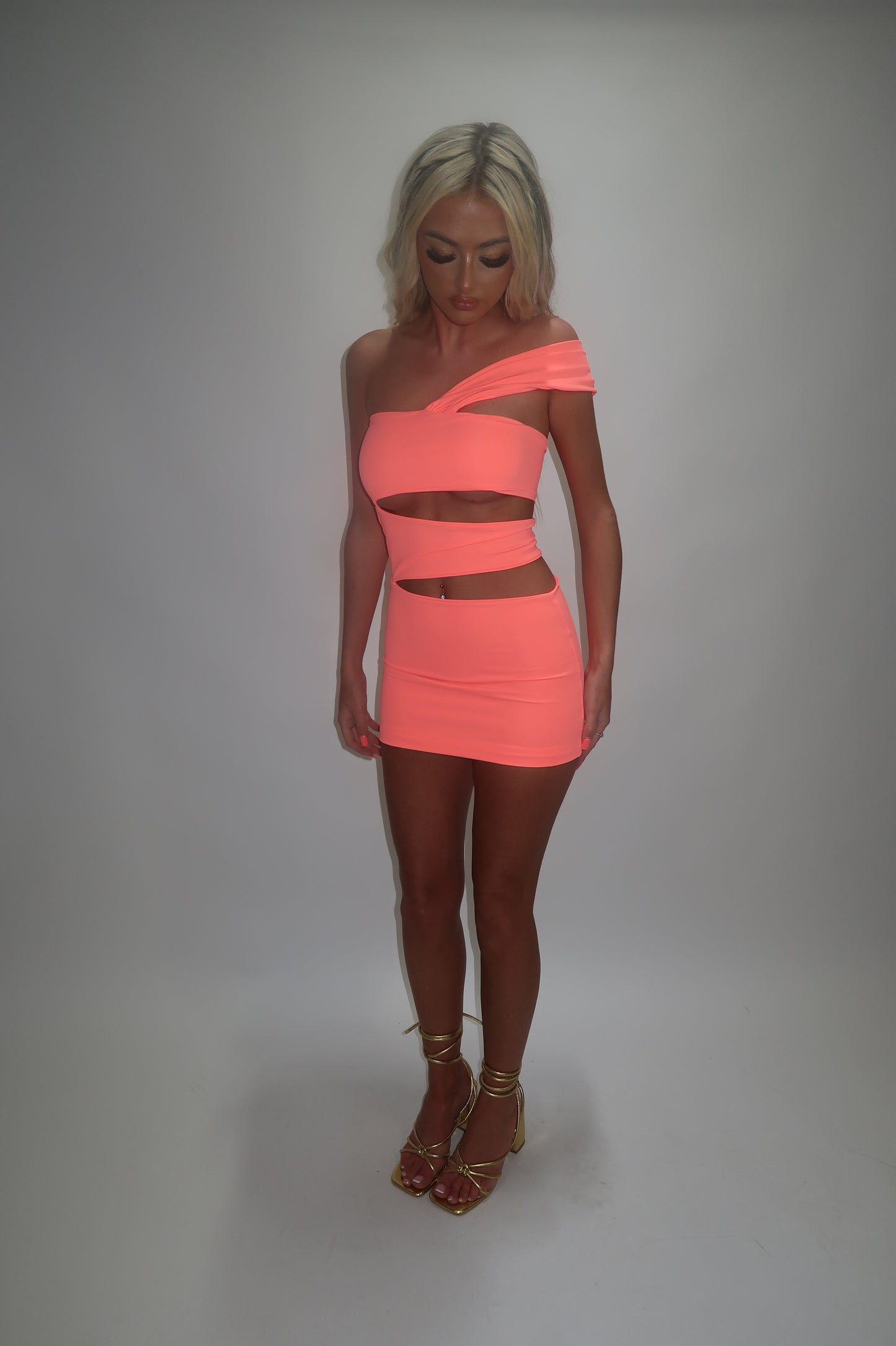 LIMITED EDITION HAND MADE AND DESIGNED IN HOUSE: ‘Aries’ coral cut out dress