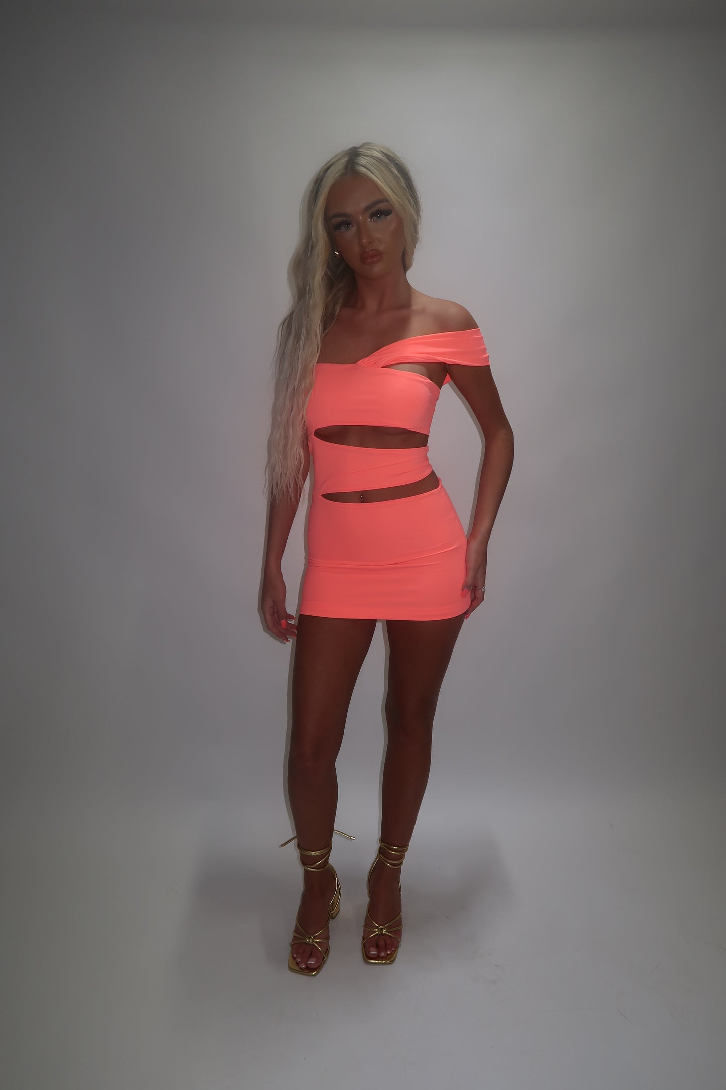LIMITED EDITION HAND MADE AND DESIGNED IN HOUSE: ‘Aries’ coral cut out dress