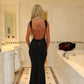 ‘Khloe’ black open back bow dress